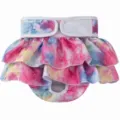 Detail view of pet dog sanitary diaper skirt featuring colorful tie-dye ruffles and adjustable velcro. - XS / Dream Pink