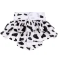 Close-up detail of black and white cow print pet dog sanitary skirt with ruffles and velcro. - S / Cow Print