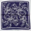 Close-up of luxury dark blue silk scarf with white horse pattern and elegant French border. - HX-22