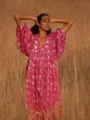 Boho floral print midi dress featuring a V-neck and short puff sleeves for beach vacations. - Magenta Print