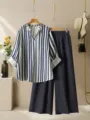 Close-up detail presentation of summer casual striped V-neck blouse and pleated trousers. - S / Top And Bottom / Dark Blue
