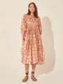 Floral midi dress detail featuring V-neck, bubble sleeves, and stylish lace-up front design. - Brown and Orange Print