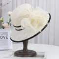 Close-up of elegant beige lace sun hat with floral decor and black trim, stylish design. - M (56-58cm) / Beige Black Brim Beige Flower