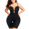 Detail view of plus size black shapewear featuring plunging V-neck and delicate lace hem. - S / Black