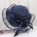 Chapeau de soleil bleu marine a large bord en maille et detail de noeud pour ete plage femme. - Taille unique / Bleu marine