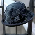 Black wool felt cloche hat for women, vintage British fedora with feather and mesh decor. - Adjustable (57cm-59cm) / Black