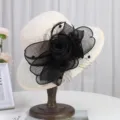 Detail shot of an elegant women sun hat with black mesh flower decoration, perfect for summer. - M (56-58cm) / Beige with Black Floral