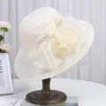 Elegant lace sun hat detail showcasing breathable fabric and decorative mesh flower design. - M (56-58cm) / Beige