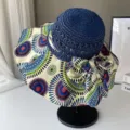 Chapeau de soleil bohème à large bord pour femme, chapeau de paille stylé avec motif et nœud. - Taille unique / Cercles bleu marine