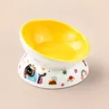 Yellow ceramic slanted cat bowl, elevated pet food water bowl with cute cartoon design. - Slanted Bowl / Yellow