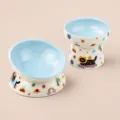 Ceramic elevated cat bowl set with cute cartoon patterns, tilt design for pet feeding, blue. - Two-Piece Set / Blue
