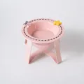Elevated cat bowl with ceramic pet bowl and cute bow star decor, pink raised stand for feeding. - Dashed Bowl with Iron Stand / Pink