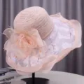 Detailed view of an elegant pink sun hat with delicate lace and floral decorations for women. - M (55-58cm) / Wide Brim Rose Style / Pink