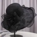 Detailed view of elegant black wide-brim sun hat with delicate lace floral decoration. - M (55-58cm) / Wide Brim Rose Style / Black