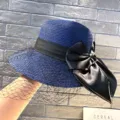 Blue straw sun hat with black bow and net veil, elegant summer beach sun protection hat. - M (56-58cm) / Blue