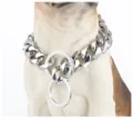 Close up of heavy stainless steel cuban link dog chain collar with rings on display model. - Steel