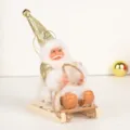 5,5-Zoll Weihnachtsmann-Puppe in Gold und Weiß auf einem Holzschlitten - Gold