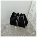 Elegant black rhinestone bucket bag featuring a silver chain strap and pearl drawstring detail. - Black