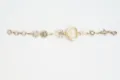 Vintage gold heart charm watch with floral and bow accents, elegant quartz wrist watch for women. - Gold
