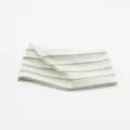 Detailed view of the wide striped knit headband, showing soft texture and elastic green stripes. - Green/White