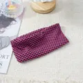 Pink and black checkered elastic headband detail shot, featuring soft fabric and stretchy design. - Pink and Black
