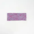 Detailed view of the elastic cotton wide headband with stylish floral pattern, soft and comfortable. - Purple