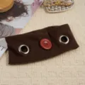Brown fabric headband with metal eyelets and red button detail, close-up styling shot - Coffee
