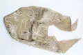 Detailed view of the champagne sequin embroidered headscarf featuring vintage floral patterns. - Champagne