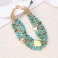Multi-layer turquoise chip beaded statement necklace with gold metal charms for beach resort. - Teal