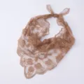 Lace floral embroidery detail on the brown triangle headscarf, showing delicate hollow design. - Coffee