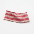 Close-up of multi-color striped knitted headband, wide elastic sports hair accessory for yoga. - Red