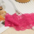 Detailed shot of vibrant pink lace headband fabric, exquisite hollow lace floral trim. - Rose Red