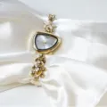 Gold irregular quartz watch with cute bear and star charm, unique fashion bracelet timepiece. - Gold