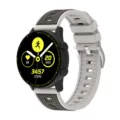 Detail view of the dual-color vertical stripe silicone replacement watch strap, flexible design. - 20mm / Starlight + Brown