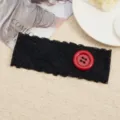 Black lace headband detail with large red button, stylish elastic hair accessory for women. - Black + Red