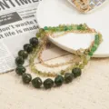 Elegant multi-layer green beaded necklace with gold chains, bohemian style chic jewelry detail. - Olive Green