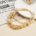 Boho multi-layer beaded necklace with gold chain, elegant resort jewelry detail view. - Off White