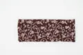 Close-up detail of the brown retro floral knitted headband, showing soft texture and clear pattern. - Coffee Lace Style / Coffee Lace