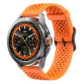 Detailed view of the 22mm orange silicone watch strap and smartwatch case designed for sports. - 22mm / Orange