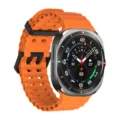 Silicone perforated watch strap compatible with smartwatches, breathable orange band design. - Silver Clasp / Orange