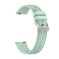 Close-up detail of the light green silicone watch strap showing quick release pin and metal buckle. - 18mm / Grass Green