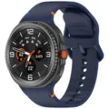 Detailed view of the blue silicone watchband with contrast stitching and orange accent. - 20mm / Midnight Blue / Stitched Style