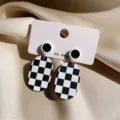 Black white checkerboard oval earrings geometric retro dangle earrings detail view. - Oval Checkerboard