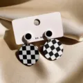 Classic black and white checkerboard earrings, geometric round design, elegant vintage style detail. - Round Checkerboard