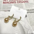 Gold C-shaped rhinestone pave hoop earrings with dangling champagne pearl charms for women. - Champagne Rhinestone