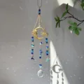 Crystal suncatcher pendant detail featuring blue beads, gold crescent moon and rainbow light. - Moon Princess - Starfish