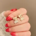 Elegante vergoldete süße Stier Ohrringe mit funkelnden Strasssteinen, ideal für den täglichen Look. - Katzenauge-Ochs