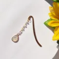 Vintage metal bookmark with teardrop crystal pendant and beaded chain, detailed view. - Teardrop - Antique Gold