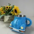 Beetle shaped coffee mug detail view, creative ceramic and stainless steel car cup gift. - Blue