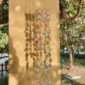 Crystal suncatcher pendant with metal chain and colorful light reflections for window decor. - AB Color